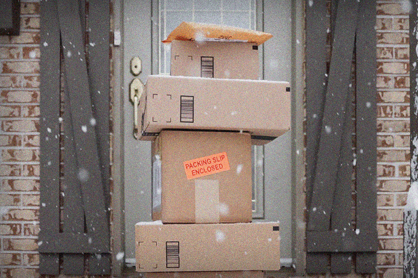Boxes stacked up on top of one another while it snows