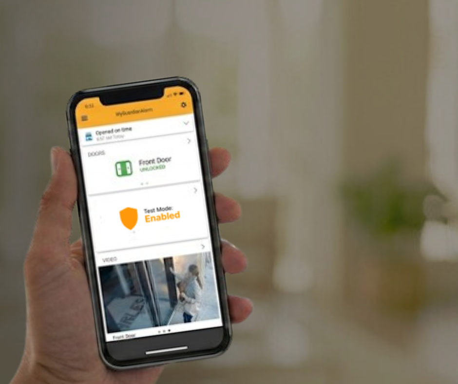 Homeowner using smartphone app to test security system status.