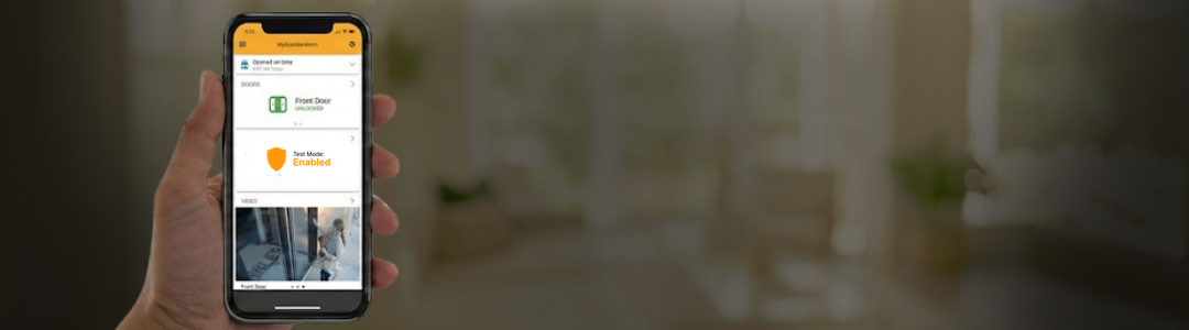 Homeowner using smartphone app to test security system status.