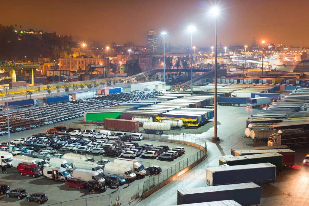 Bird's eye view of a trucking and logistics center at night