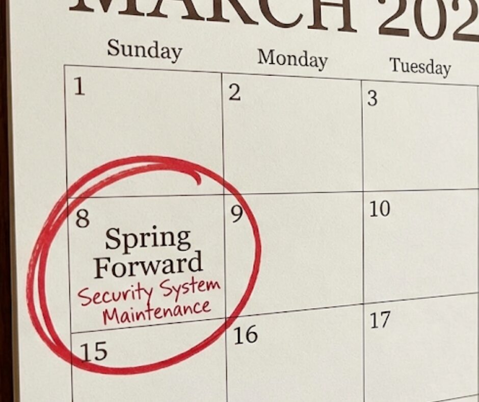 Daylight saving time home safety reminder showing a clock springing forward and a homeowner changing smoke detector batteries, Home security system maintenance diagram highlighting the alarm panel, smoke detectors, and motion sensors for annual cleaning and testing.