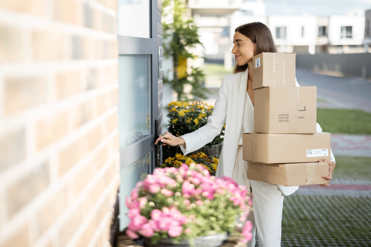 Woman coming home with parcels